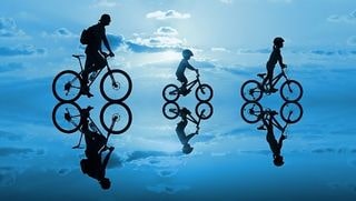 A bike ride on water with reflection just needs a bike speaker
