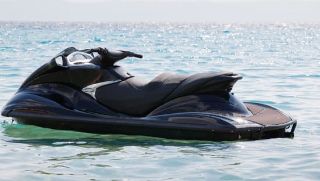 black jet ski floating on water